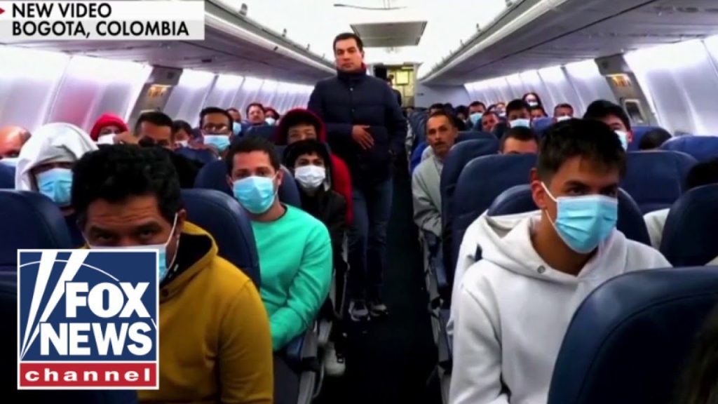 NEW: Migrant deportees land in Colombia after Trump feud