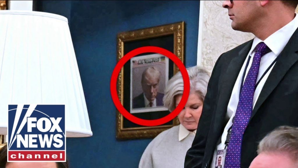 Trump hangs iconic mugshot outside the Oval Office